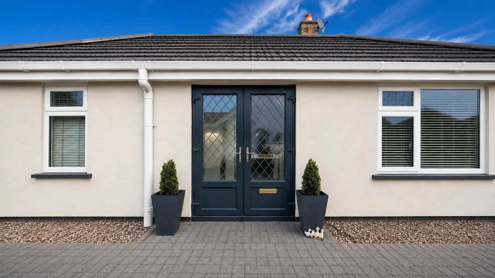 A white UPVC front door resprayed in anthracite grey by Cutting Edge Spraying
